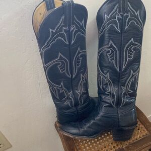 Tall leather cowboy boots. See photos for small worn leather on heels.